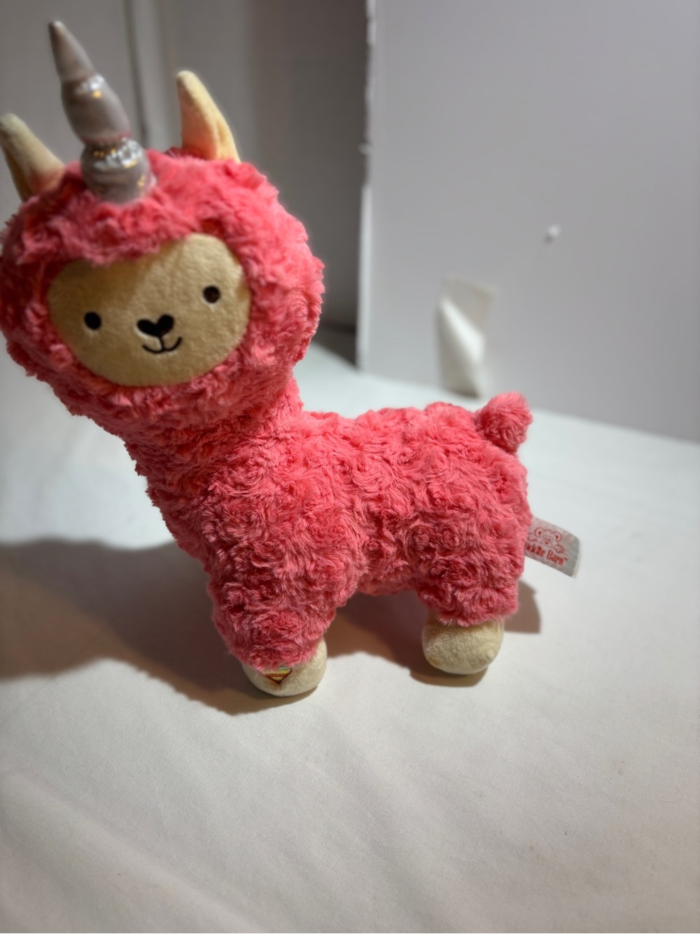 Cuddle Barn Coral Pink Fluffy Musical Plush with Cream Accents